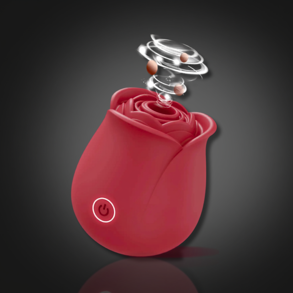 Red rose-shaped clitoral stimulator showing suction opening