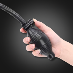 Hand operating the manual penis pump squeeze bulb